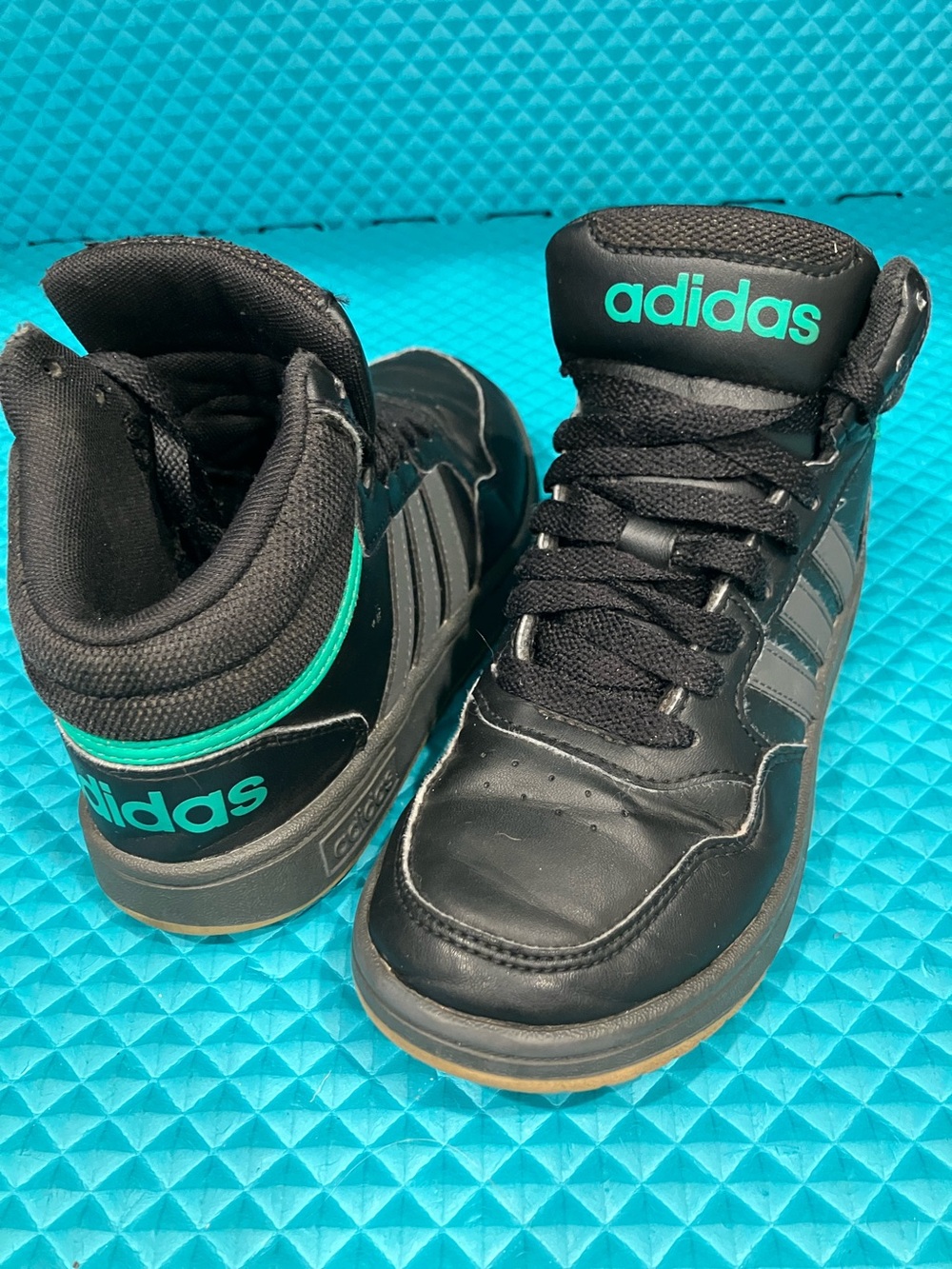 ADIDAS Kids LeatheHoops Mid Sneakers, specifically in the Black | 1